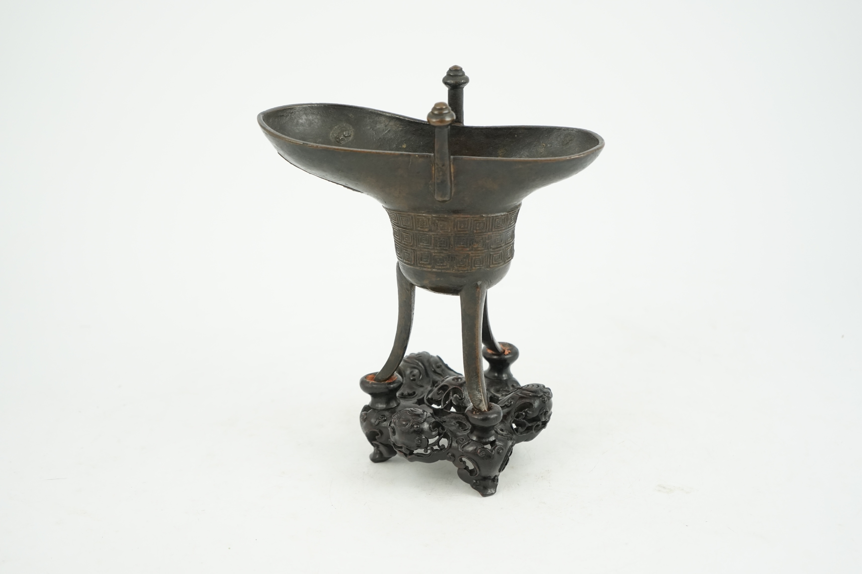 A good Chinese archaistic bronze tripod wine cup, jue, dated Qianlong 3rd year, corresponding to 1738